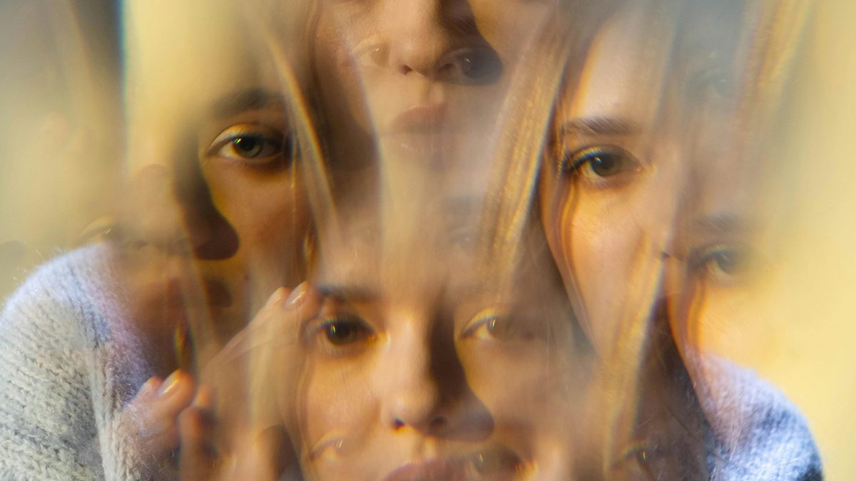 A multi-exposure portrait showing many overlapping faces — judging which model output is right